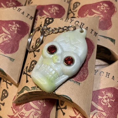 Recycled plastic skull keychains glow in the dark (with rhinestone eyes)