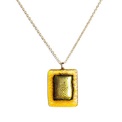Dichroic yellow circles on iridescent  amber fused glass pendant necklace