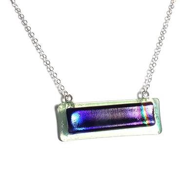 Dichroic deep purple rainbow on transparent green fused glass bar necklace