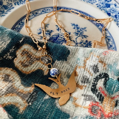 “fly free” necklace 