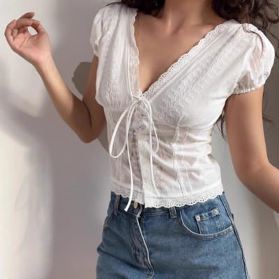 White lace v-neck top with ties on the chest