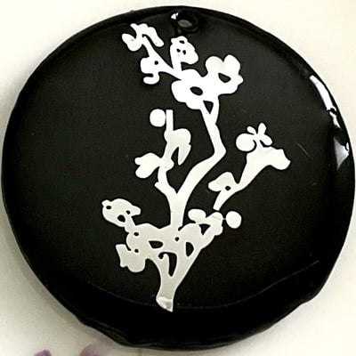 Black floral shell pendant