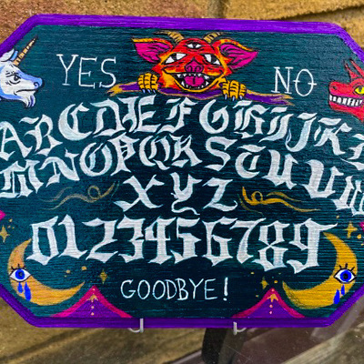Fantastical hand-painted wooden spirit board