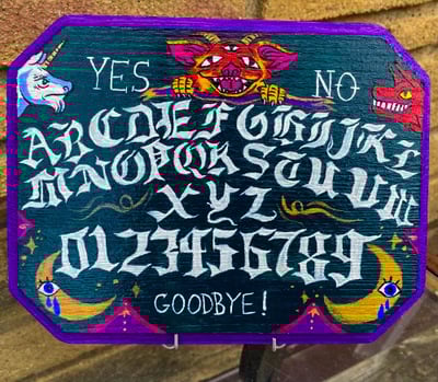 Fantastical hand-painted wooden spirit board